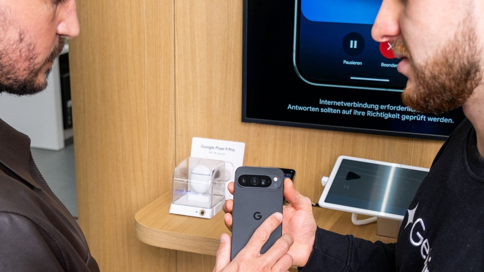 A nonplusultra Brand Experience Specialist demonstrating a Google Pixel 9 Pro in the brand space