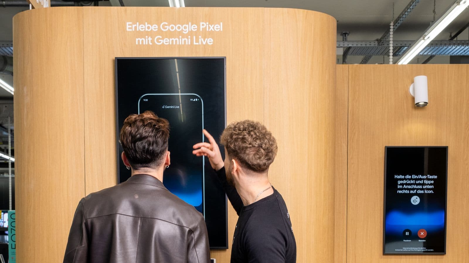 A specialist showing Gemini Live on the demo wall of the Google Pixel brand space