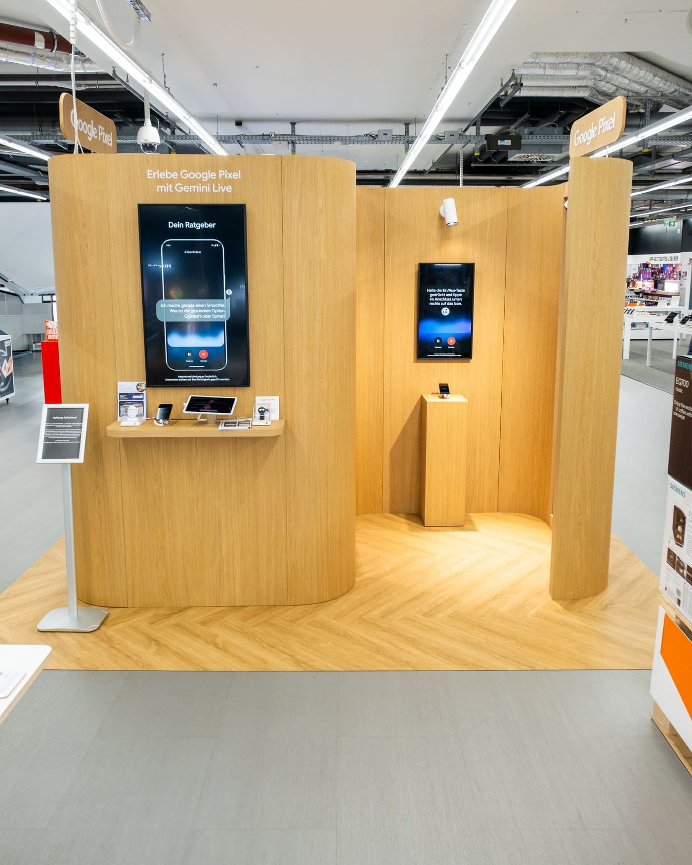 The Google Pixel brand space built by nonplusultra, standing in the aisle of a MediaMarkt store