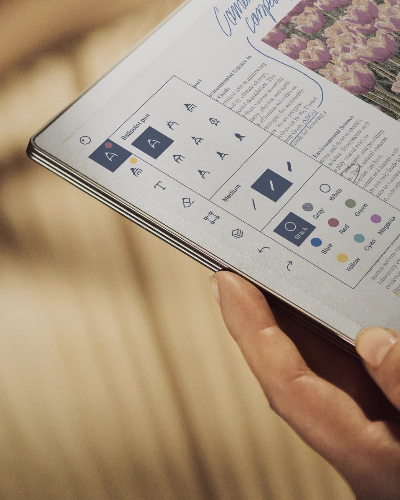 A reMarkable Paper Pro with colour display held in two hands, product image from reMarkable